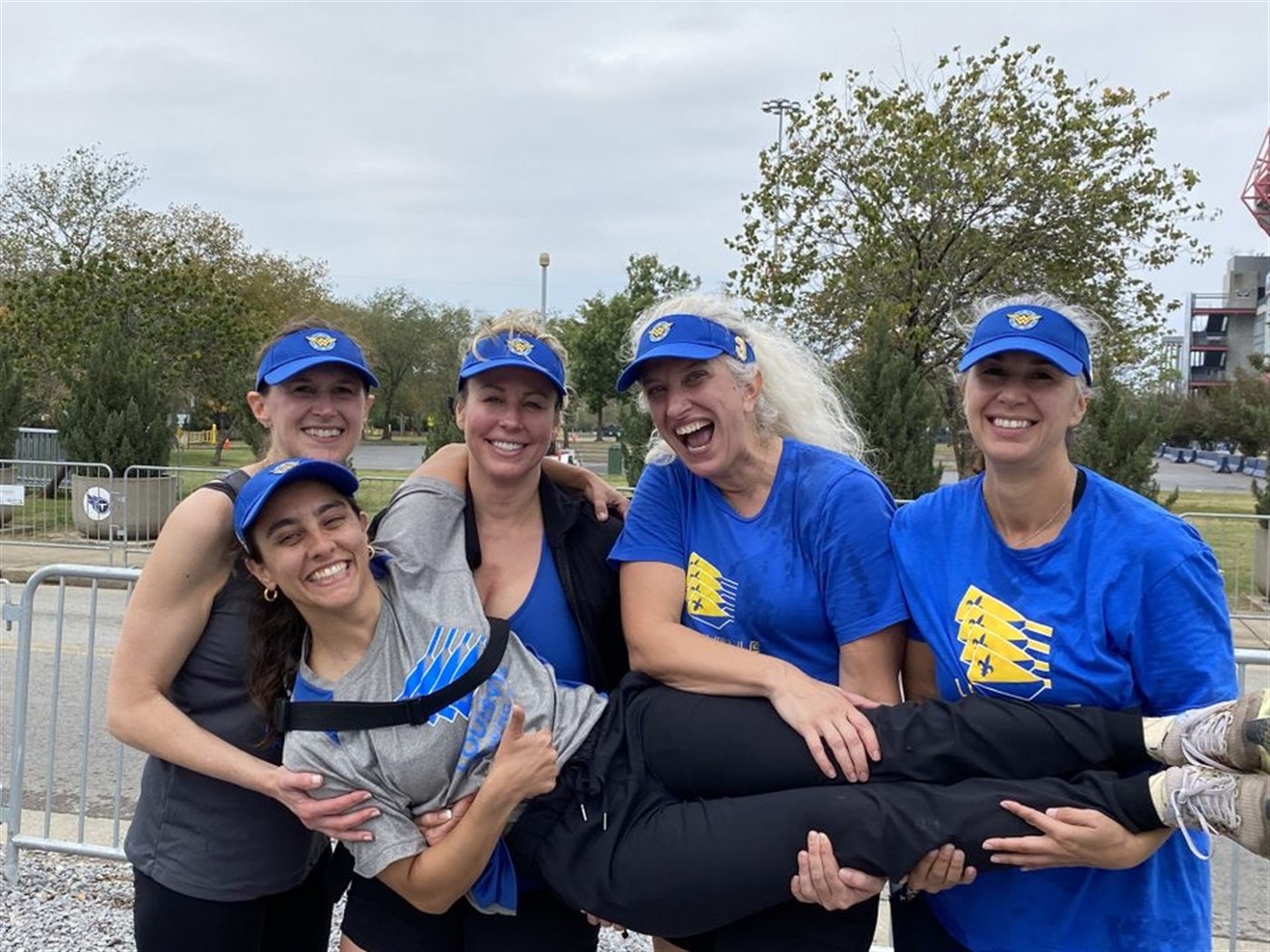Louisville Rowing Club masters teammates laughing together at a regatta